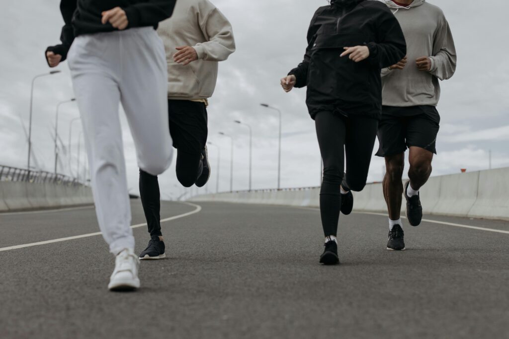 common running mistakes for beginners - featured image - feet of runners, running
