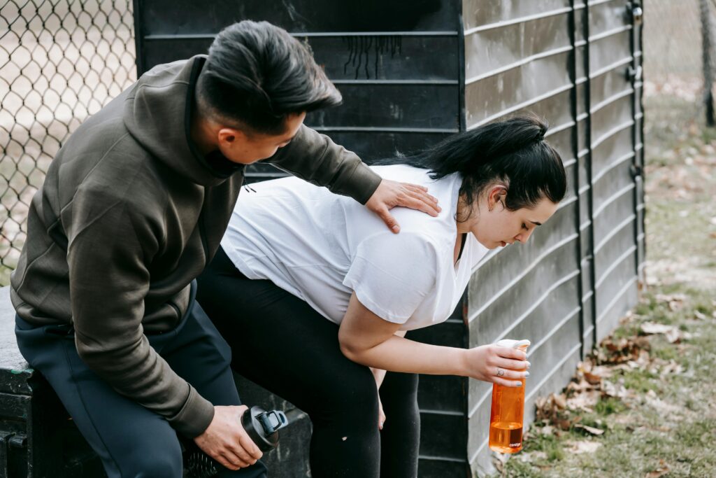 woman hydrating - after warming up before workout