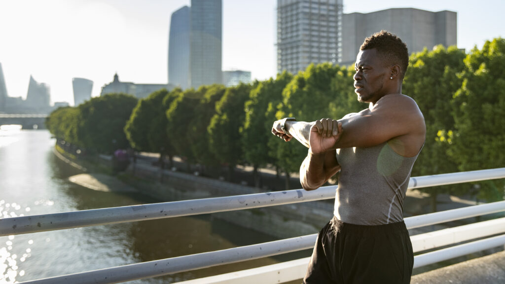 man doing stretching - doing morning workout - benefits