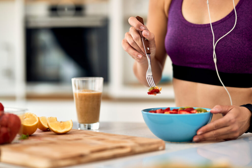 Woman eating her post-workout snacks
