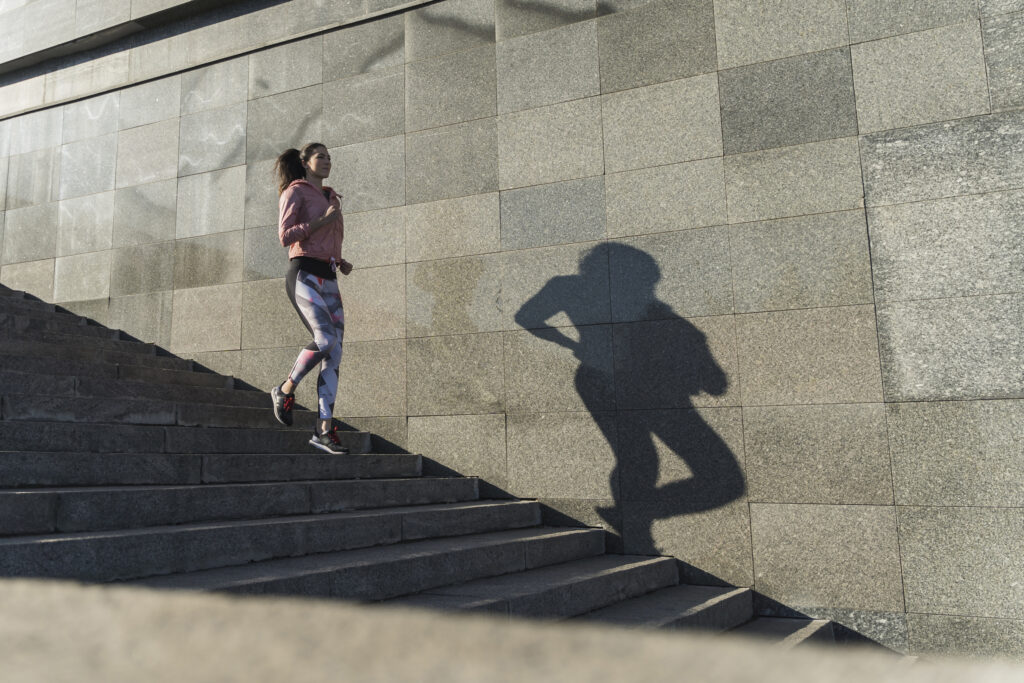 woman taking 10,000 steps a day on stairs