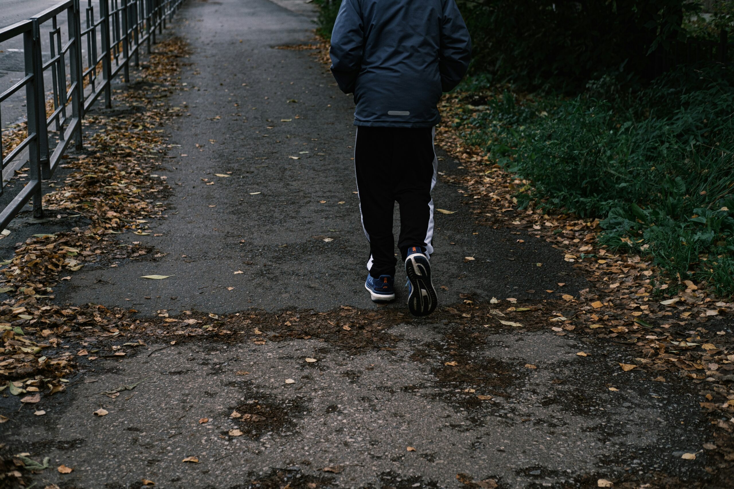 person walking, following his walking schedule for weight loss